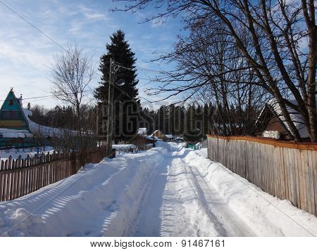 Village in winter sunny day