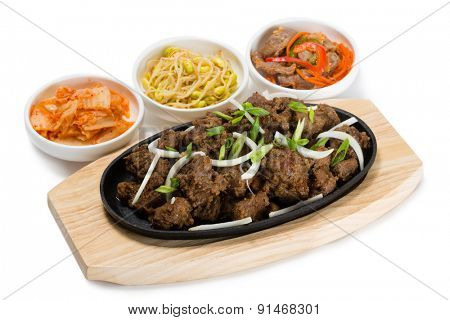 Roasted lamb with onions in a skillet and salads heh. From a series of Food Korean cuisine.