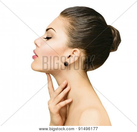 Beauty Portrait. Beautiful Spa Woman Touching her Face. Perfect Fresh Skin. Beauty brunette Model. Youth and Skin Care Concept. Studio shot