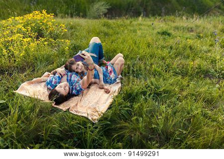 Mother And Daughter Make Selfy On The Rug