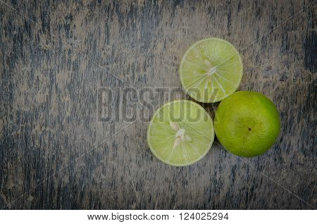 Lemon on old wooden background: still life.