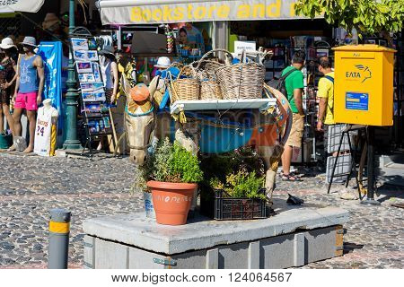 THIRA, SANTORINI, GREECE - AUGUST 26, 2015: Sculpture of donkey as decoration of main street of Thira town.