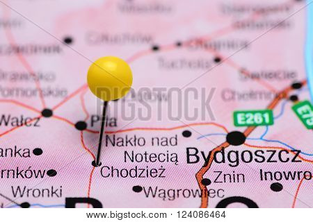 Photo of pinned Chodziez on a map of Poland. May be used as illustration for traveling theme.