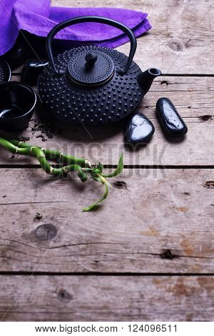 Traditional asian tea set on aged wooden background. Selective focus. Place for text.