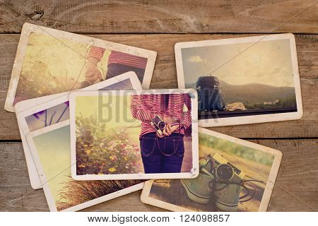 Travel photo album on wood table. vintage and retro style