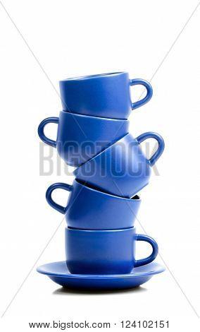 Five blue ceramic coffee cups placed one onto antoher.