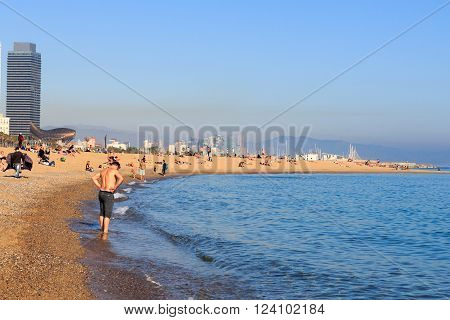 Barcelona, Spain - November 11, 2015: Beach in Barceloneta and Mediterranean Sea. La Barceloneta is a neighborhood in the Ciutat Vella district of Barcelona. It is known for its sandy beach.