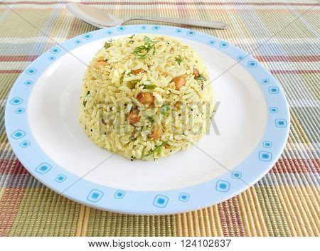 Indian food raw mango rice, which is a traditional and popular dish, is especially made on the festival day of Ugadi.