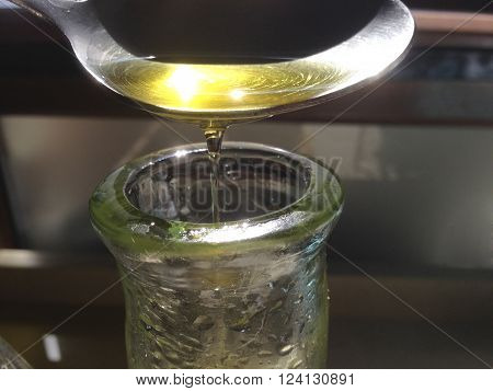Glass oil cruet isolated over white background. High view