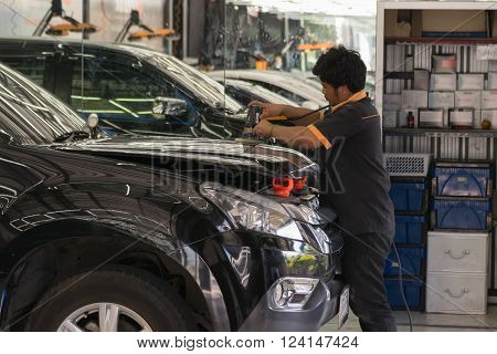 Bangkok Thailand - December 12 2015 : Unidentified car care staff cleaning the car (Car detailing).