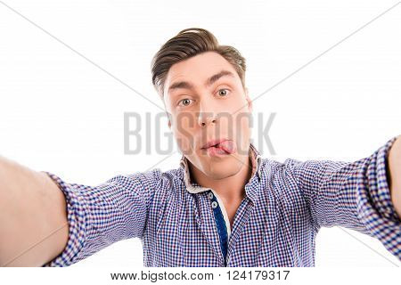 Funny Young Man Making Comic  Selfie And Showing Tongue