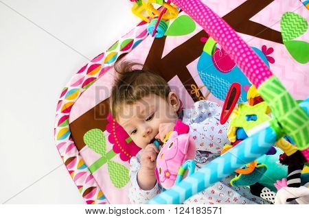 Baby Girl Palying In An Activity Gym