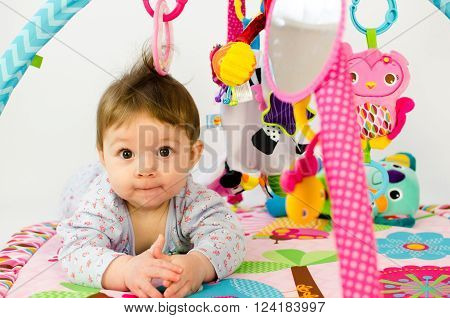 Baby Girl Palying In An Activity Gym