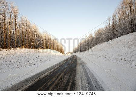Photographed Road In The Winter. Winter, The Road Is Covered With Snow