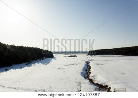 white snow lying on the ground in winter