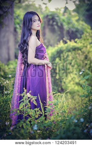 portrait of asia women with mask on nature canival concept