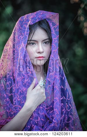 Asia Beautiful Lady Covered In Violet Fabrics