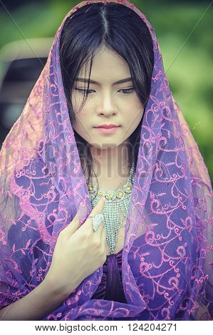 portrait of asia women with mask on nature canival concept