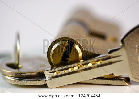 Close up keys and lock Cylinder on white background
** Note: Shallow depth of field