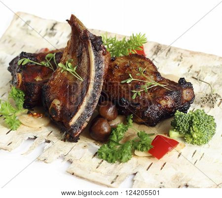 Grilled pork ribs with mushrooms and herbs