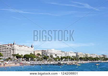 Cannes, France - September 18, 2013: Landscape view of the beach and jetty in front of the Carlton International Hotel situated on the croisette boulevard in Cannes, France