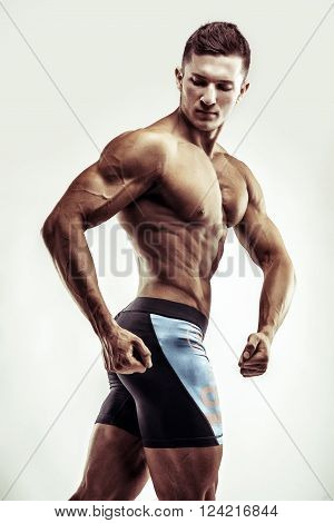 Bodybuilder Man Posing, Showing Perfect Abs, Houlders, Biceps, Triceps, Chest