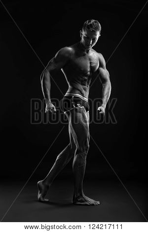 Bodybuilder Man Posing, Showing Perfect Abs, Houlders, Biceps, Triceps, Chest