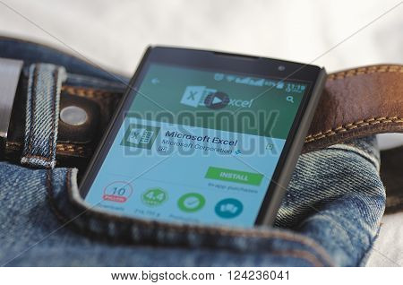 SARANSK, RUSSIA - April 3, 2016: Photo of Smartphone in a jeans pocket with Microsoft Excel application in a Google Play Store on the screen.