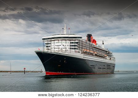 Adelaide Australia - March 10 2014: RMS Queen Mary 2 with people on board is leaving for cruise from Outer Harbour in Port Adelaide South Australia