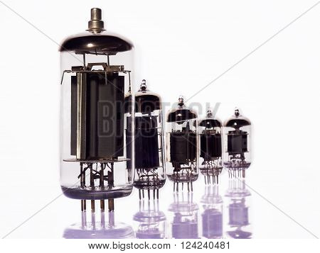 Vacuum lamps set in a row diagonally on a white background