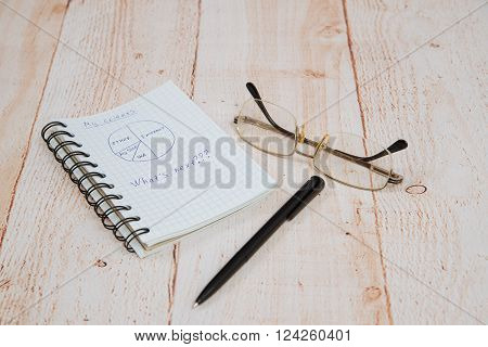 ballpoint pen glasses and an open notebook lying on the table
** Note: Visible grain at 100%, best at smaller sizes