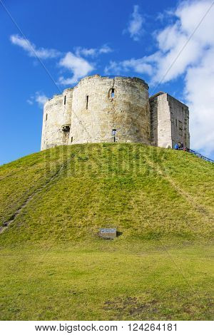 Clifford Tower in York in England. Clifford Tower is a remaining part of York Castle. The York City is situated in North Yorkshire in England.