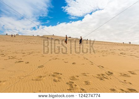 People Visiting The Highest Sand Dune Of Pyla In Europe