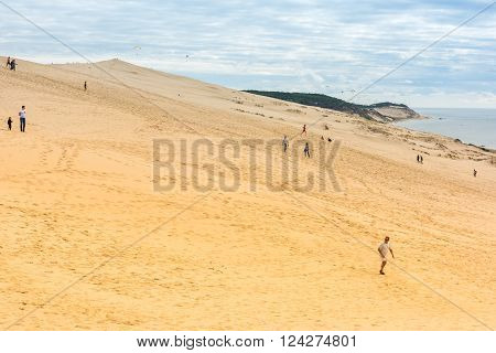 People Visiting The Highest Sand Dune Of Pyla In Europe