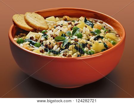Isolated Orange bowl with cereals and vegetable lentils soup with croutons