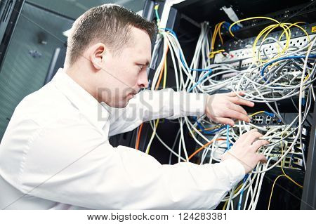 network engineer administrating in server room 