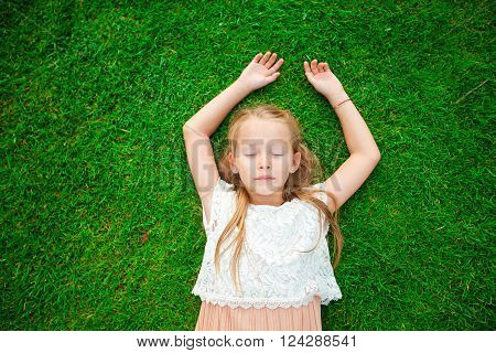 Adorable little girl outdoors in the park