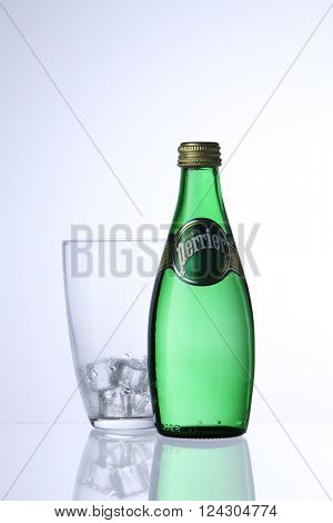 KUALA LUMPUR, MALAYSIA - Feb 17, 2016 perrier drinking water with glass with ice cube