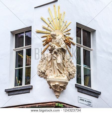 Antwerp Belgium - January 18 2015: Close up of newly restored Virgin Mary and baby Jesus statue in Antwerp Belgium. Created by Lawrence Gillis in 18th century it was restored in December 2014. The Virgin Mary is Antwerp's patron saint.