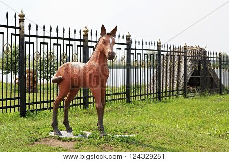 Novotyryshkino, Russia - July 31, 2013: Sculpture foal in Tourist Complex Siberian Podvorye.