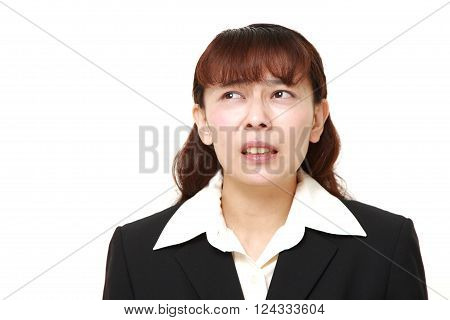 portrait of  perplexed businesswoman on white background