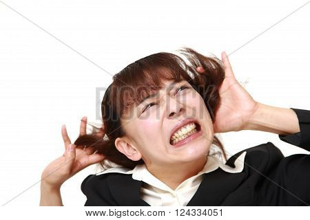 portrait of demented businesswoman on white background