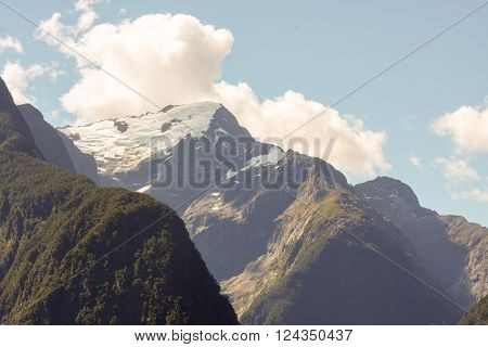Snow covered mountain peak in Fjordland New Zealand