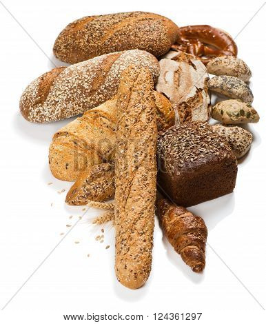 Assortment of different kind of cereal bakery: bread pasties buns and croissants isolated on a white background.