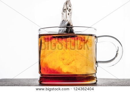 Brewed tea with tea bag horizontal background