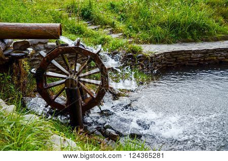 Working Watermill Wheel With Falling Waterin The Village.