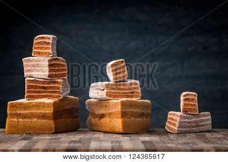 Pyramids of pastila pieces on the wooden table