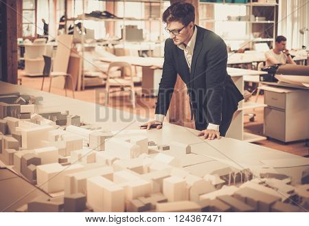 Young architect working in architect studio.