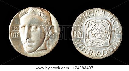 YUGOSLAVIA - CIRCA 1976 : Silver medallion, made by Zlatara Majdanpek - Yugoslavia,  that shows portrait of scientist Nikola Tesla.