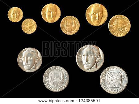 YUGOSLAVIA - CIRCA 1976 : Set of gold and silver medallions, made by Zlatara Majdanpek - Yugoslavia, that show portrait of scientist Nikola Tesla.